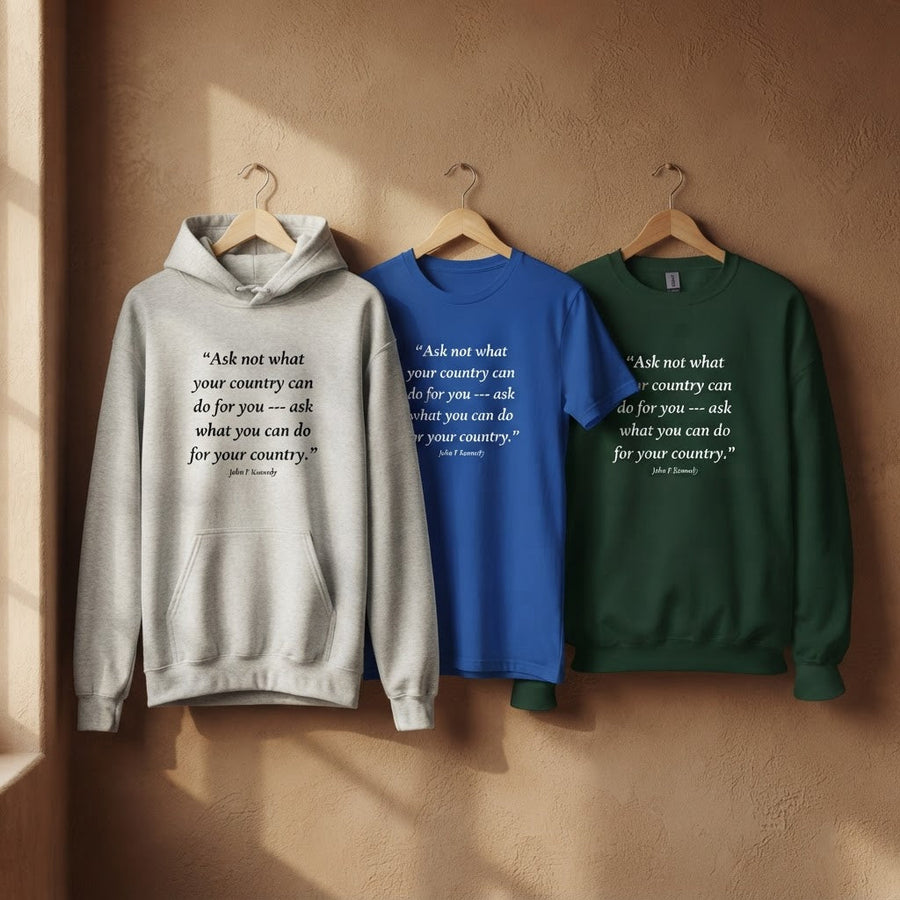 Three garments printed with John F. Kennedy's ‘Ask not what your country can do for you’ quote, shown on coathangers