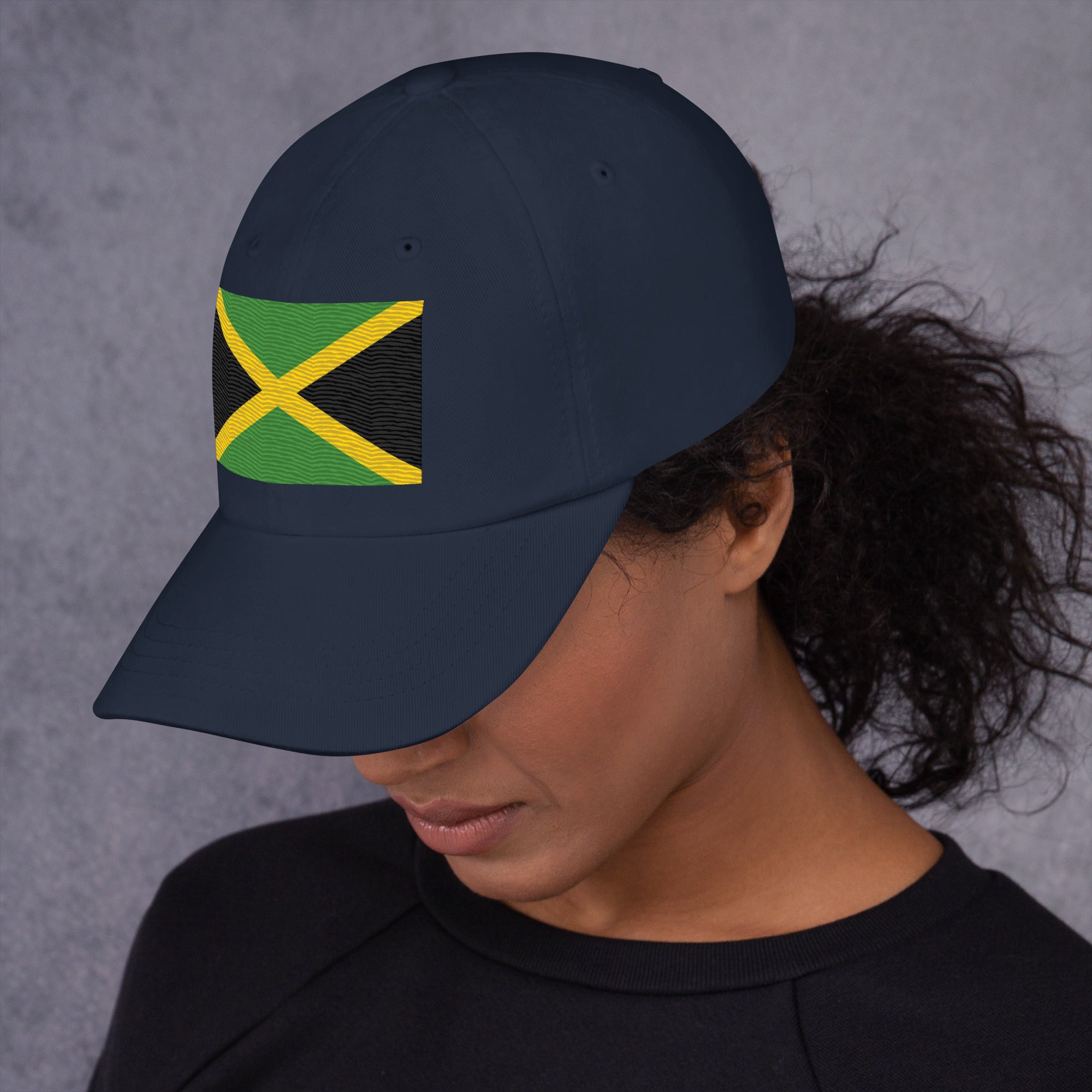 Baseball cap with embroidered Jamaica flag featuring gold diagonal cross on black and green