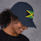Baseball cap with embroidered Jamaica flag featuring gold diagonal cross on black and green