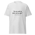 Unisex black t-shirt with 2 Corinthians 5:7 Bible verse printed in black text on front