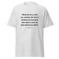 Unisex black t-shirt with 1 John 4:7 Bible verse printed in black text on front