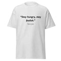 Unisex black t-shirt featuring Steve Jobs Hungry Foolish quote typography printed across the front chest