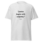 Unisex black t-shirt featuring Justice Empathy quote typography printed across the front chest