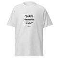 Unisex black t-shirt featuring Justice Truth quote typography printed across the front chest