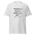 Unisex black t-shirt featuring Benjamin Franklin Rebellion to Tyrants quote typography printed across the front chest