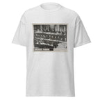 Unisex heather gray t-shirt featuring vintage Nuremberg Tribunal poster artwork printed across the front