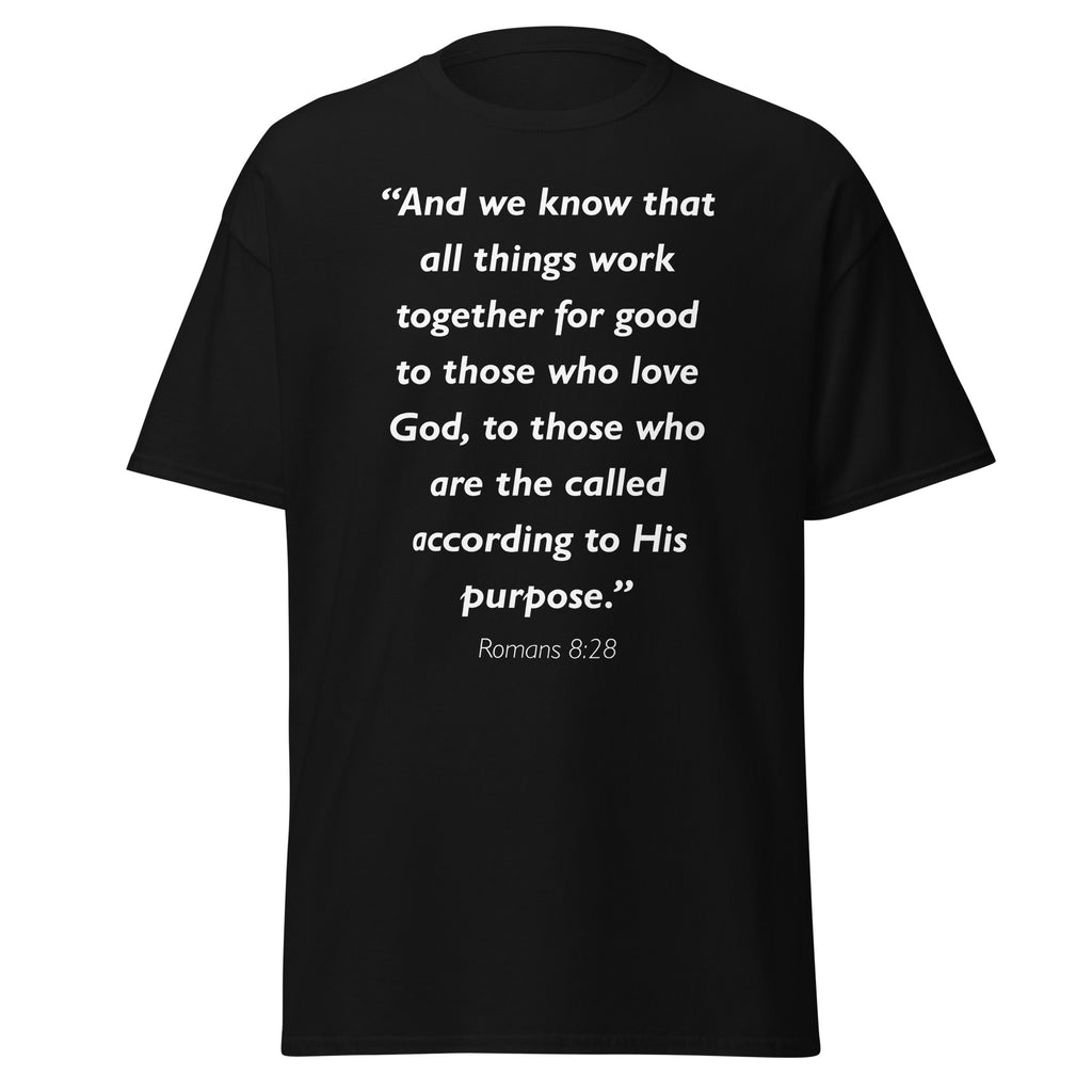Unisex black t-shirt with Romans 8:28 Bible verse printed in white text on front