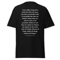 Unisex black t-shirt with 1 Corinthians 13:4-7 Bible verse printed in white text on front