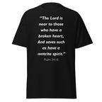 Unisex black t-shirt with Psalm 34:18 Bible verse printed in white text on front