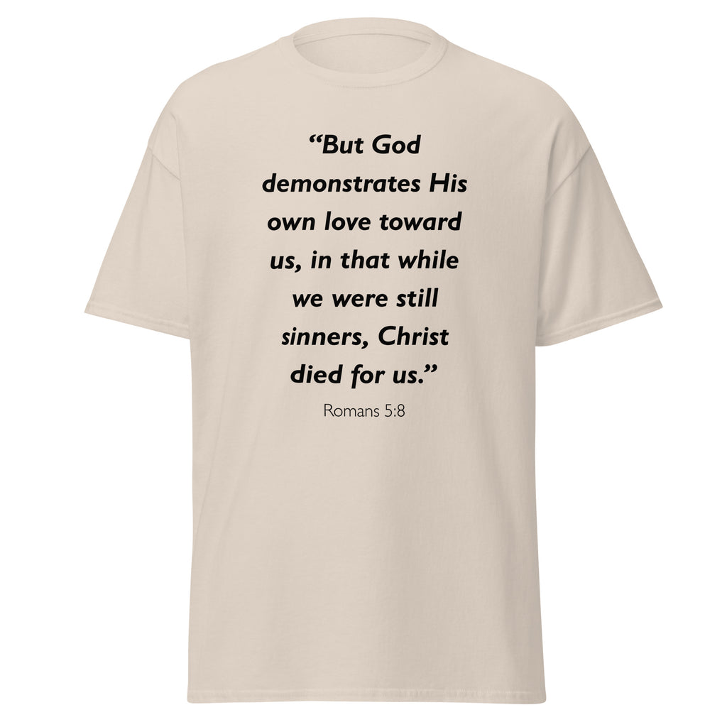 Unisex heather gray t-shirt with Romans 5:8 Bible verse printed in black text on front