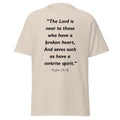 Unisex heather gray t-shirt with Psalm 34:18 Bible verse printed in black text on front