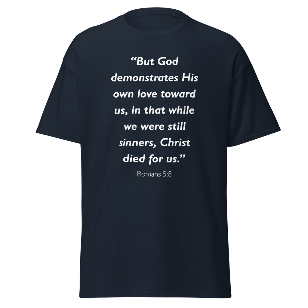 Unisex heather gray t-shirt with Romans 5:8 Bible verse printed in white text on front