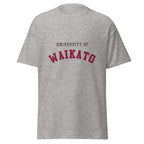Unisex heather gray t-shirt featuring University of Waikato logo printed across the front chest