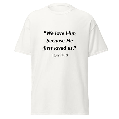 Unisex heather gray t-shirt with 1 John 4:19 Bible verse printed in black text on front