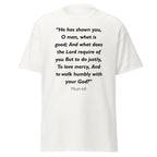 Unisex black t-shirt with Micah 6:8 Bible verse printed in black text on front