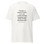 Unisex black t-shirt with 2 Corinthians 5:17 Bible verse printed in black text on front