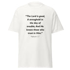 Unisex black t-shirt with Nahum 1:7 Bible verse printed across the chest