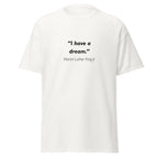Unisex black t-shirt featuring Martin Luther King MLK Dream quote typography printed across the front chest