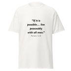 Unisex black t-shirt with Romans 12:18 Bible verse printed across the chest