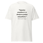 Unisex black t-shirt featuring Martin Luther King Jr Injustice quote typography printed across the front chest