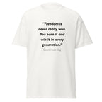 Unisex black t-shirt featuring Coretta Scott King Freedom quote typography printed across the front chest