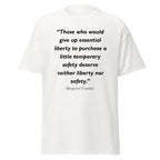 Unisex black t-shirt featuring Benjamin Franklin Temporary Safety quote typography printed across the front chest