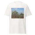 Unisex black t-shirt featuring Camille Pissarro painting "Orchard in Bloom" printed across the front