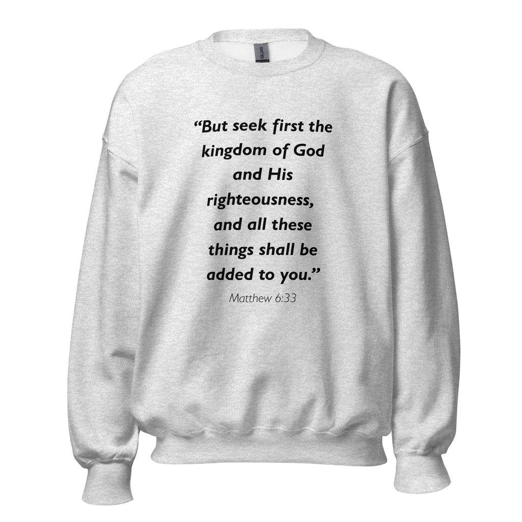 Unisex black sweatshirt with Matthew 6:33 Bible verse printed in black text on front