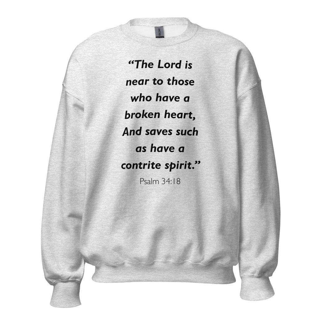 Unisex heather gray sweatshirt with Psalm 34:18 Bible verse printed in black text on front