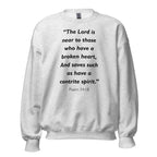 Unisex heather gray sweatshirt with Psalm 34:18 Bible verse printed in black text on front
