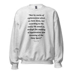 Unisex black sweatshirt with Titus 3:5 Bible verse printed in black text on front