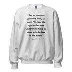 Unisex navy blue sweatshirt with John 1:12 Bible verse printed in white text on front