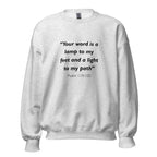 Unisex black sweatshirt with Psalm 119:105 Bible verse printed in black text on front