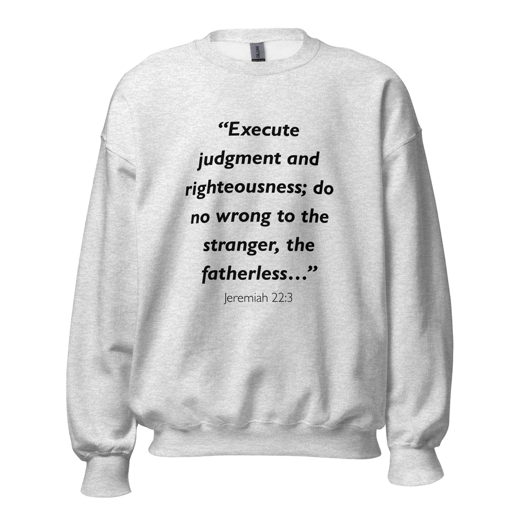 Unisex black sweatshirt with Jeremiah 22:3 Bible verse printed across the chest