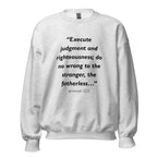 Unisex black sweatshirt with Jeremiah 22:3 Bible verse printed across the chest