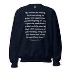 Unisex black sweatshirt with Philippians 4:6-7 Bible verse printed in white text on front