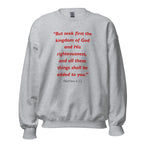 Unisex heather gray sweatshirt with Matthew 6:33 Bible verse printed in red text on front