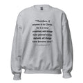 Unisex black sweatshirt with 2 Corinthians 5:17 Bible verse printed in black text on front