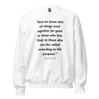 Unisex navy blue sweatshirt with Romans 8:28 Bible verse printed in black text on front