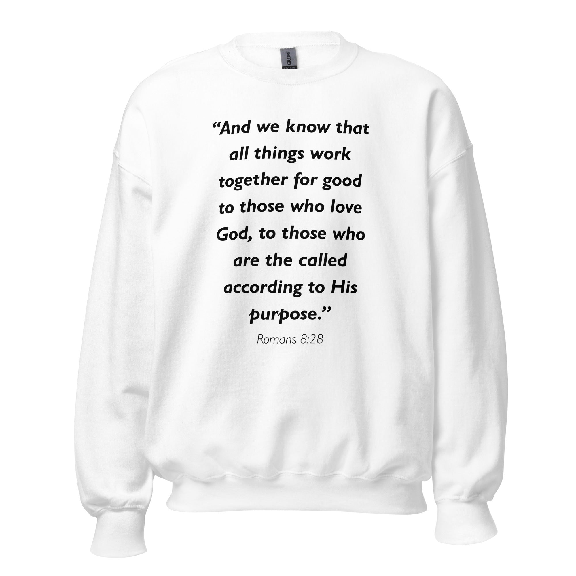 Unisex navy blue sweatshirt with Romans 8:28 Bible verse printed in black text on front