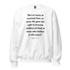Unisex black sweatshirt with John 1:12 Bible verse printed in white text on front