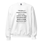 Unisex navy blue sweatshirt with 2 Corinthians 5:17 Bible verse printed in black text on front