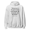 Unisex black hoodie featuring Abraham Lincoln of the People quote typography printed across the front chest
