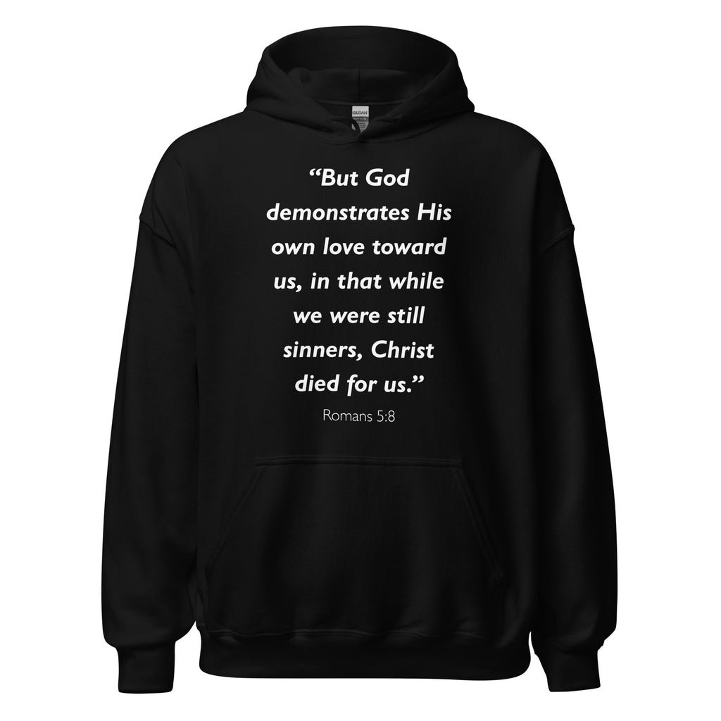 Unisex heather gray hoodie with Romans 5:8 Bible verse printed in white text on front
