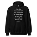 Unisex heather gray hoodie with Romans 5:8 Bible verse printed in white text on front