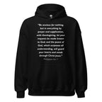 Unisex black hoodie with Philippians 4:6-7 Bible verse printed in white text on front