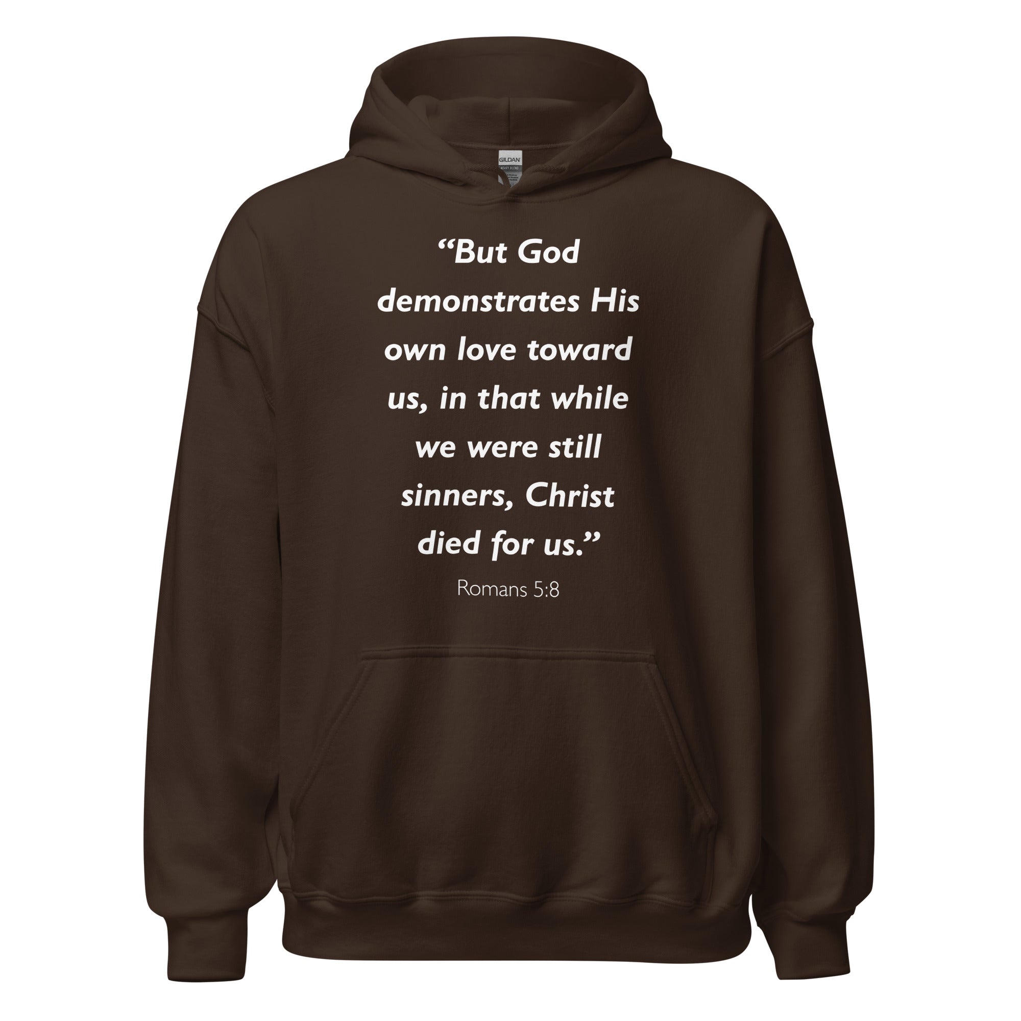 Unisex black hoodie with Romans 5:8 Bible verse printed in white text on front