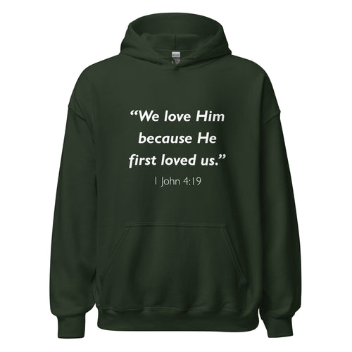 Unisex black hoodie with 1 John 4:19 Bible verse printed in white text on front