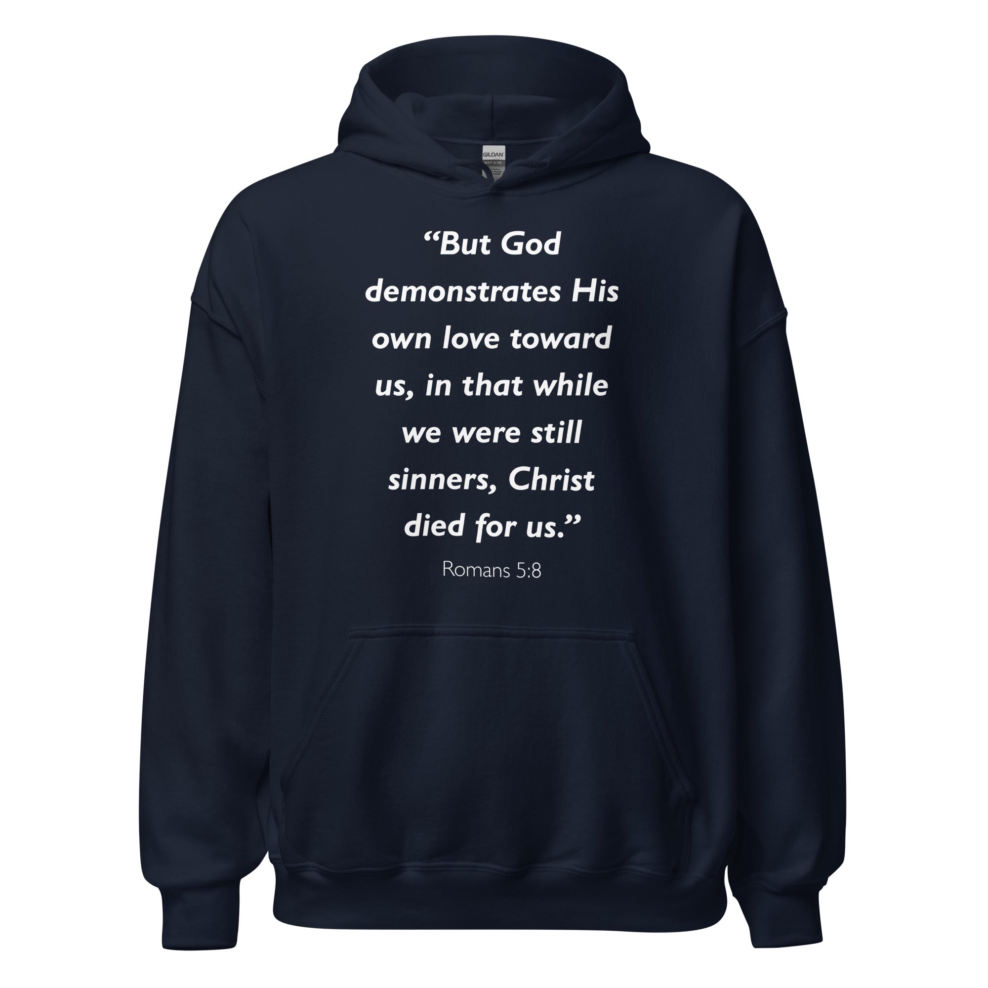 Unisex navy blue hoodie with Romans 5:8 Bible verse printed in white text on front