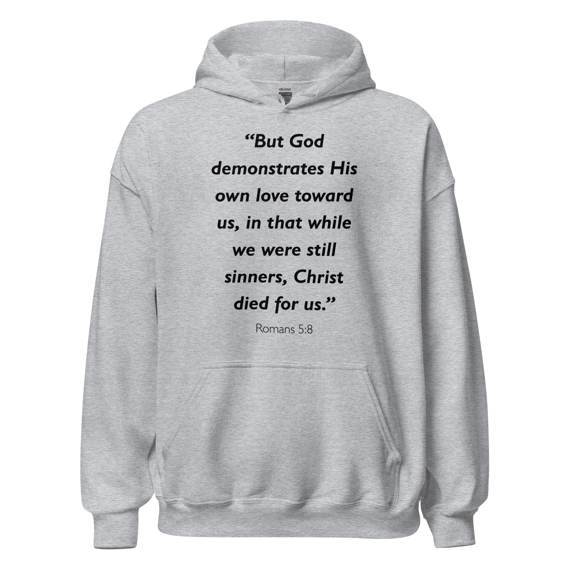 Unisex heather gray hoodie with Romans 5:8 Bible verse printed in black text on front